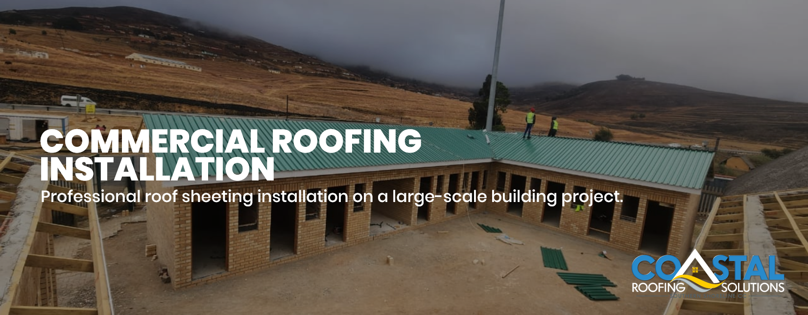 Large commercial building with professionally installed green roof sheeting by Coastal Roofing Solutions during construction in KwaZulu-Natal, South Africa.